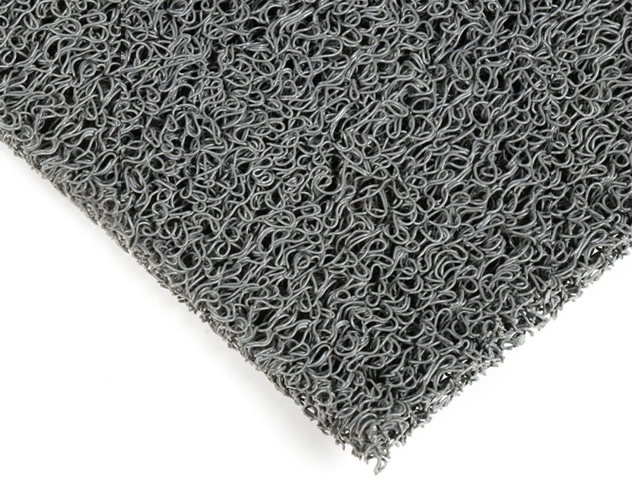 Alfombra de rizos de 15mm, fabricada en goma vinilo sin base. Disponible en rollos con una amplia variedad de colores.