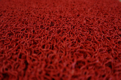 Alfombra de rizos de 15mm, fabricada en goma vinilo sin base. Disponible en rollos con una amplia variedad de colores.